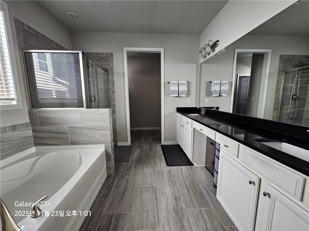 1909 Lakeview Bend Way Buford, GA 30519 - Photo 5 of 30 a kitchen with granite countertop a sink and a refrigerator