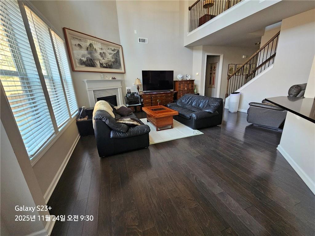 1909 Lakeview Bend Way Buford, GA 30519 - Photo 9 of 30 a living room with furniture and a flat screen tv