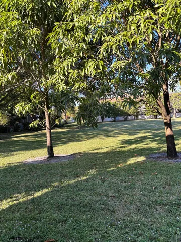 a view of a swimming pool with an outdoor space and seating area