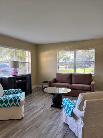 a living room with furniture and a window