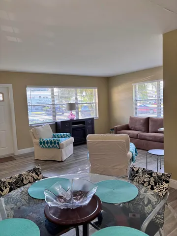 a living room with furniture and a table