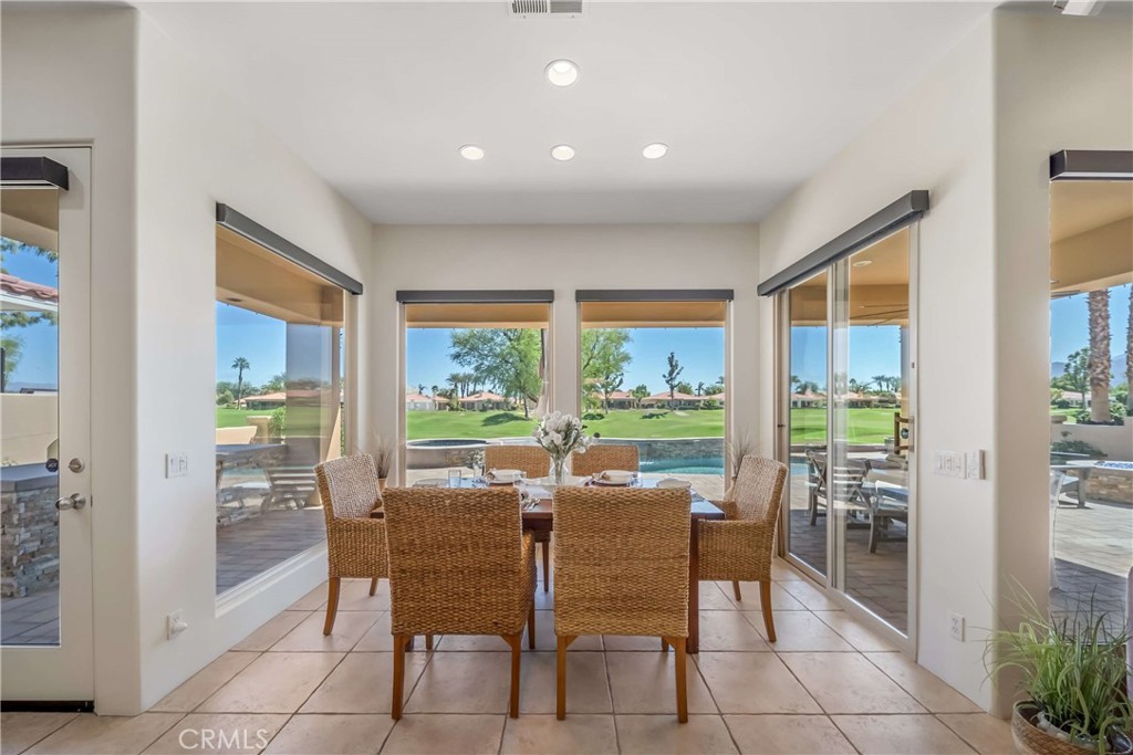 80305 Cedar Crest La Quinta, CA 92253 - Photo 15 of 26 a dining room with furniture and large windows