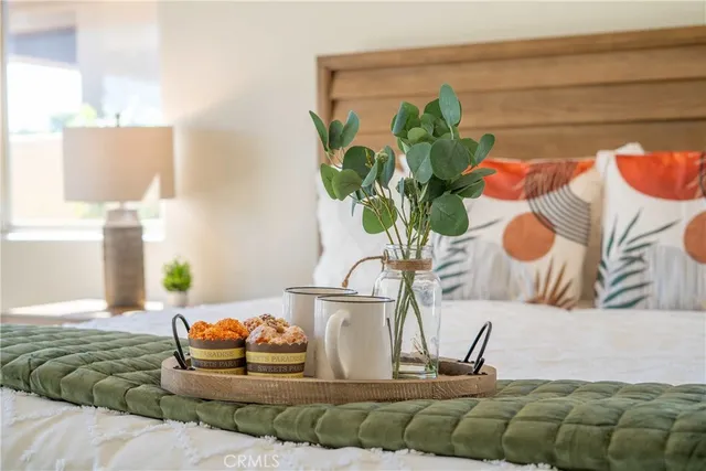 a spacious bedroom with a bed and a couch