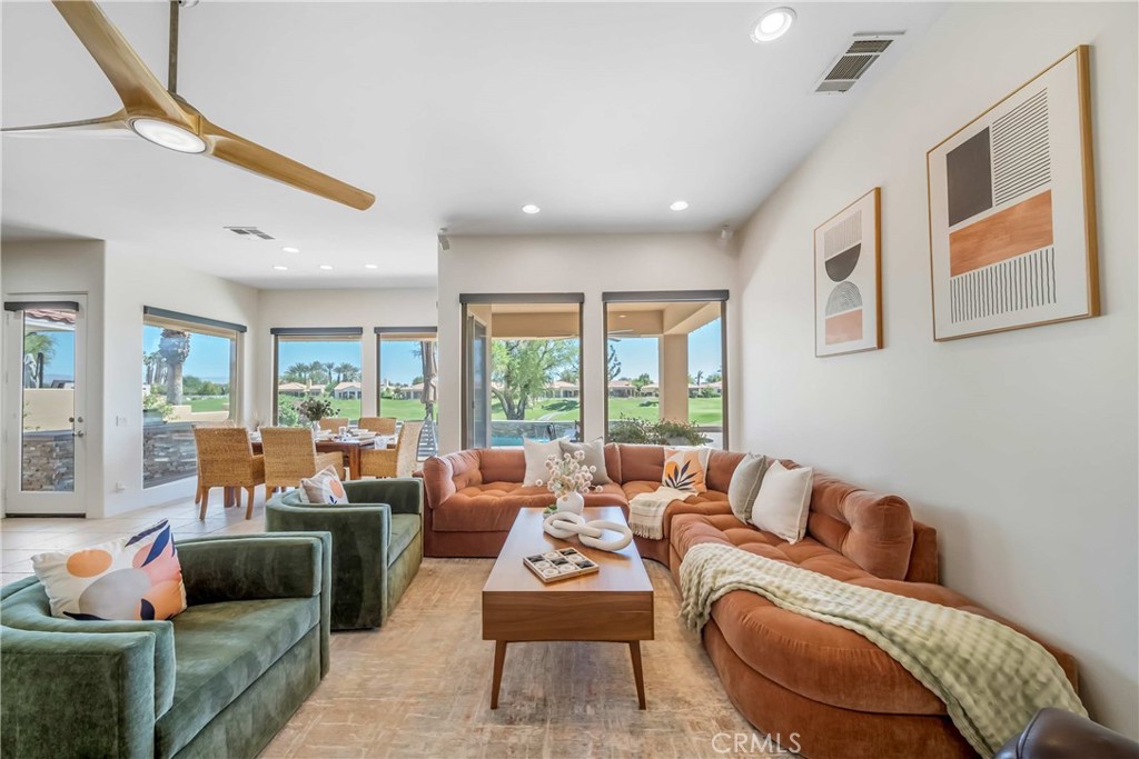 80305 Cedar Crest La Quinta, CA 92253 - Photo 6 of 26 a living room with furniture and a large window