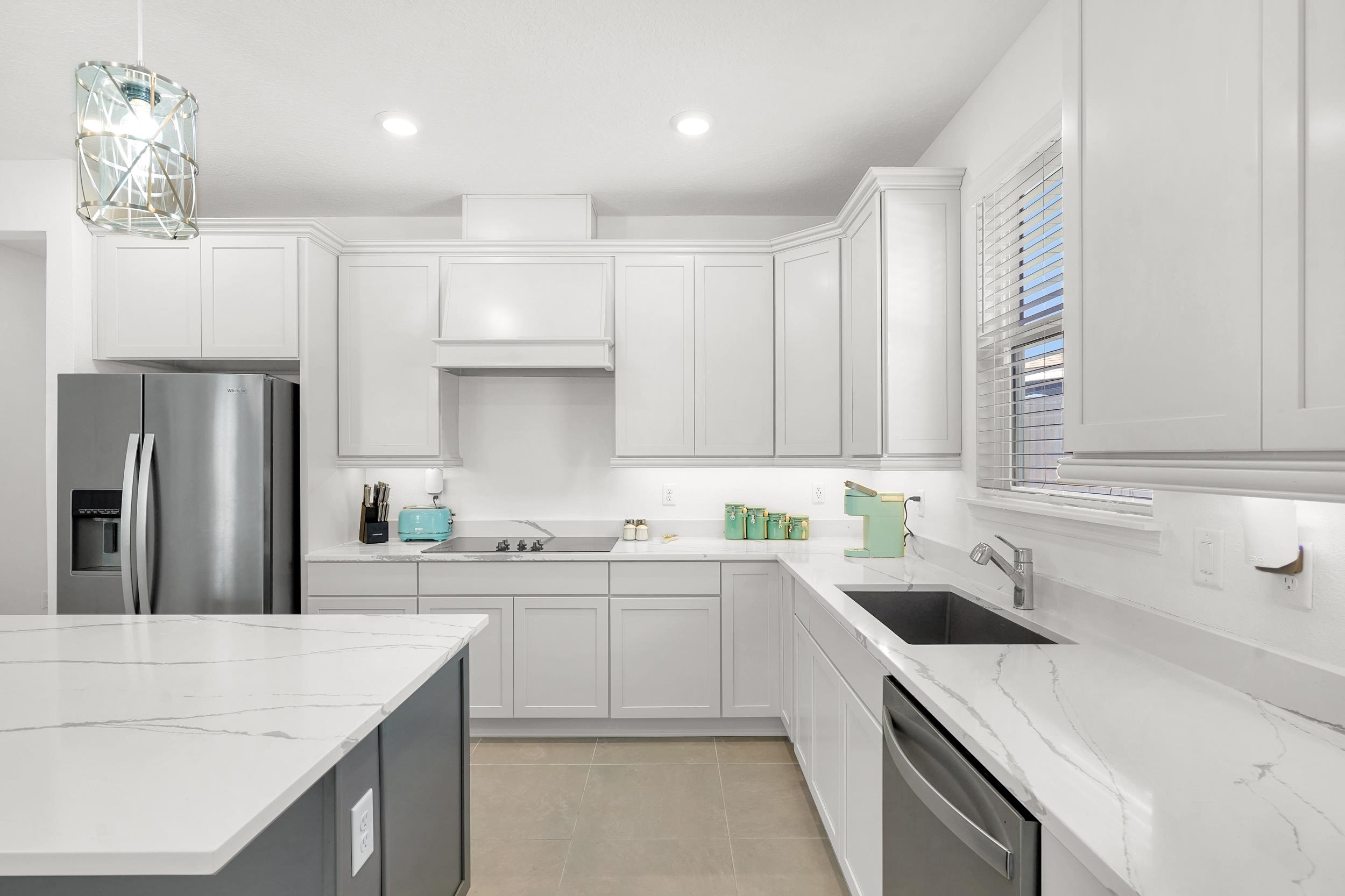 127 Shell Crk Court St. Augustine, FL 32086 - Photo 11 of 38 a kitchen with a sink a stove a refrigerator and a sink