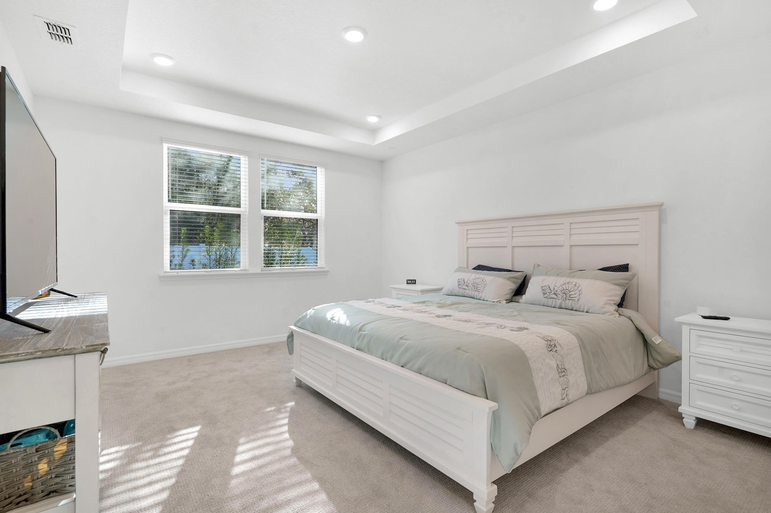 127 Shell Crk Court St. Augustine, FL 32086 - Photo 15 of 38 a bedroom with a bed and a flat tv screen