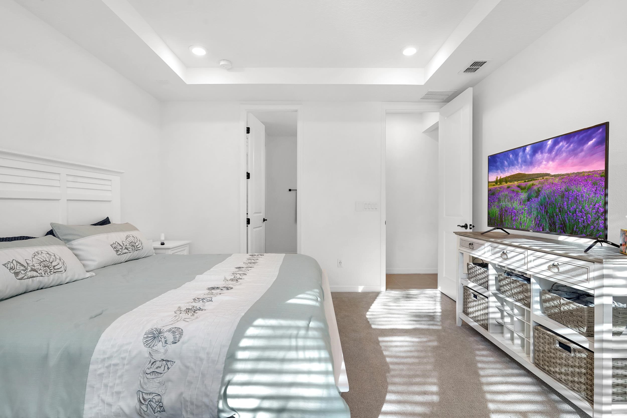 127 Shell Crk Court St. Augustine, FL 32086 - Photo 18 of 38 a bedroom with a bed and a flat screen tv