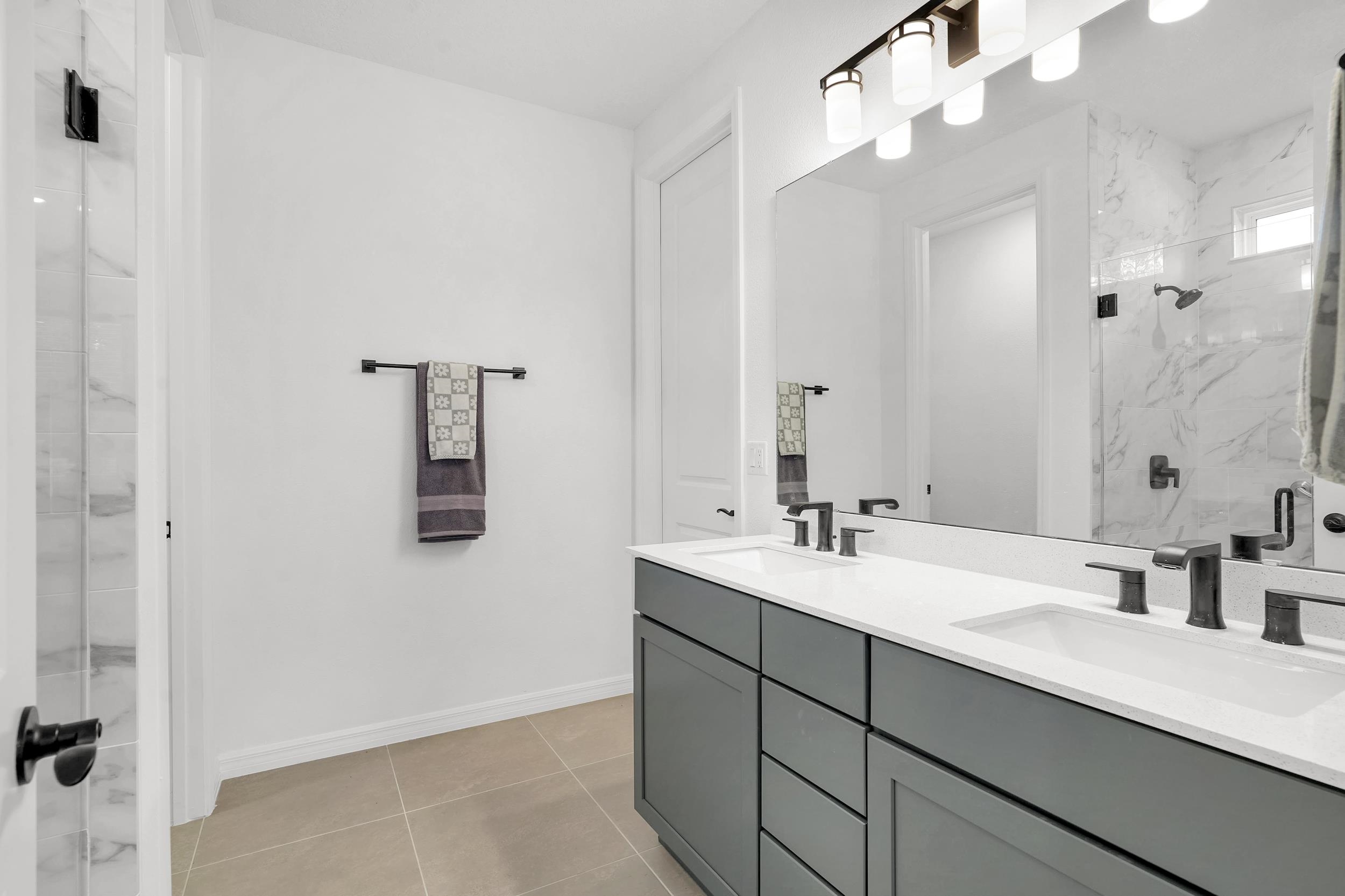 127 Shell Crk Court St. Augustine, FL 32086 - Photo 19 of 38 a bathroom with a double vanity sink mirror and