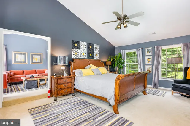 a bed room with a bed and a chair