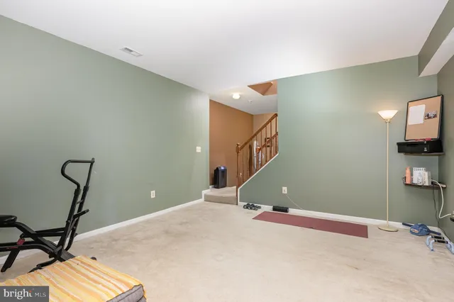 a workspace with furniture and mirror