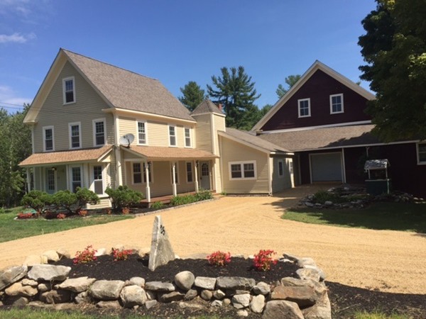 25 Walnut Hill Road Sandown, NH 03873 - Photo 1 of 29 a front view of a house with a yard outdoor space and lake view