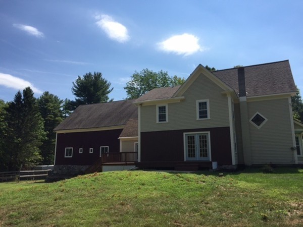25 Walnut Hill Road Sandown, NH 03873 - Photo 22 of 29 a front view of a house with a yard