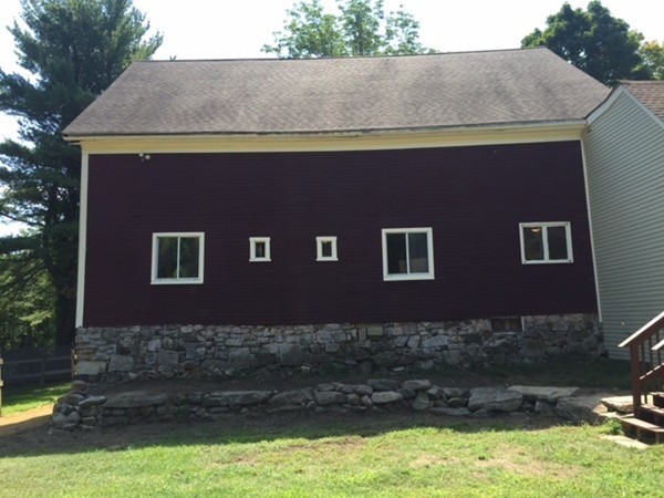 25 Walnut Hill Road Sandown, NH 03873 - Photo 25 of 29 a front view of a house with a yard