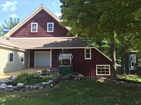 25 Walnut Hill Road Sandown, NH 03873 - Photo 27 of 29 a front view of a house with a yard