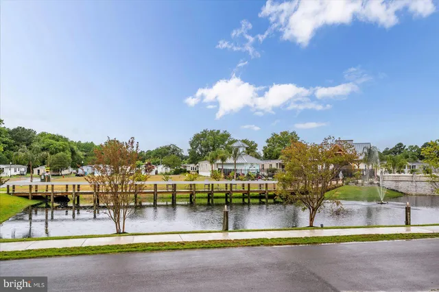 a front view of a house with porch and outdoor seating
