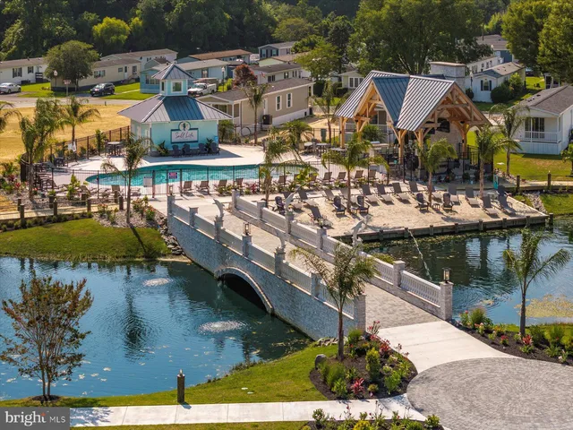 a view of a swimming pool with sitting area