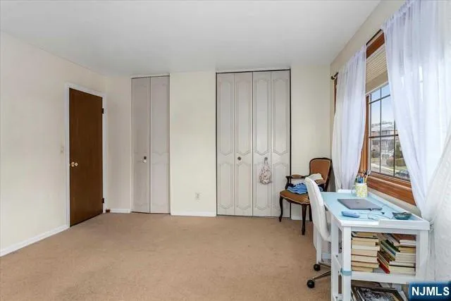 a workspace with furniture and window