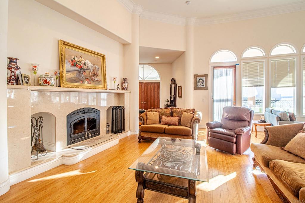 2057 Via Rancho Parkway Escondido, CA 92029 - Photo 11 of 56 a living room with furniture fireplace and a large window