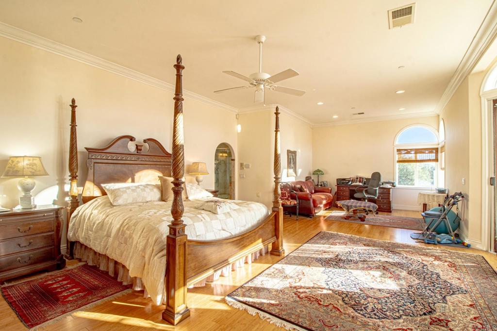 2057 Via Rancho Parkway Escondido, CA 92029 - Photo 22 of 56 a bed room with a bed and a couch