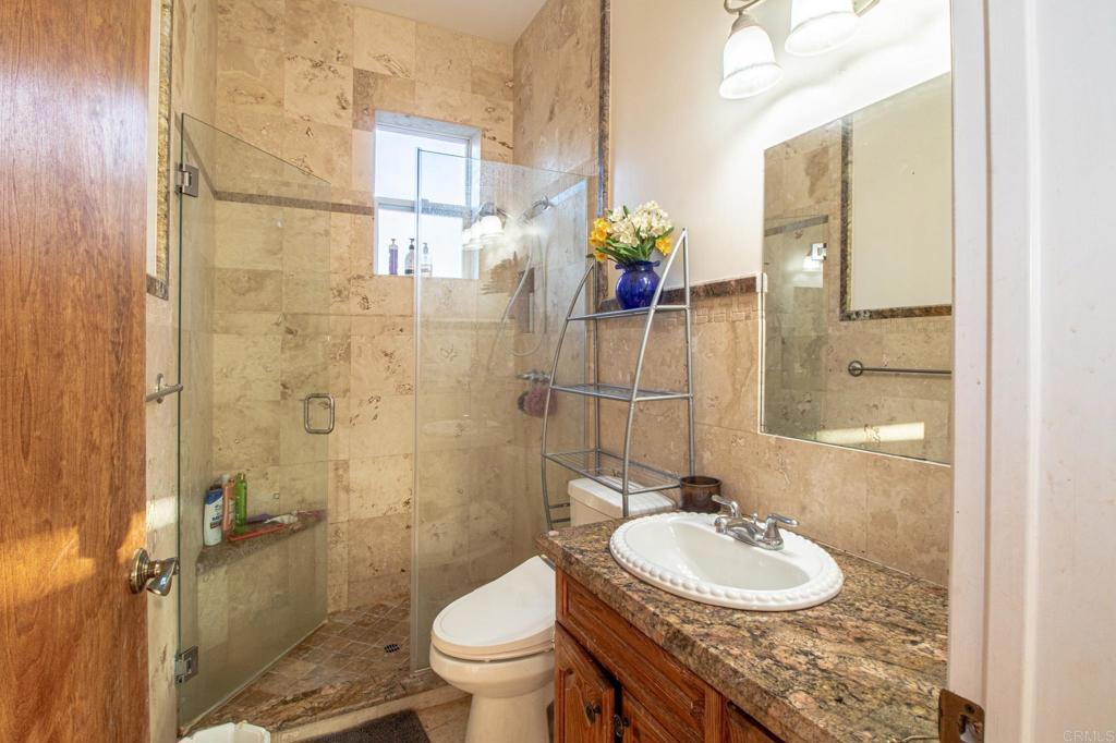 2057 Via Rancho Parkway Escondido, CA 92029 - Photo 36 of 56 a bathroom with a sink toilet and shower