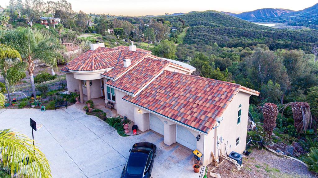 2057 Via Rancho Parkway Escondido, CA 92029 - Photo 4 of 56 an aerial view of a house with a yard and lake view