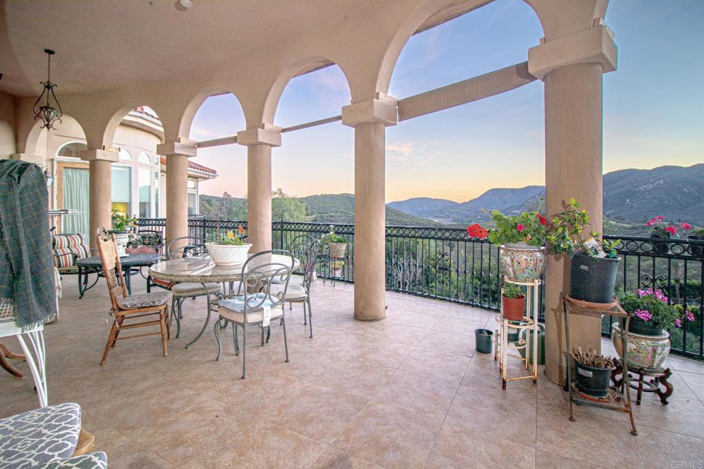 2057 Via Rancho Parkway Escondido, CA 92029 - Photo 50 of 56 a dining room with furniture water garden and mountain view