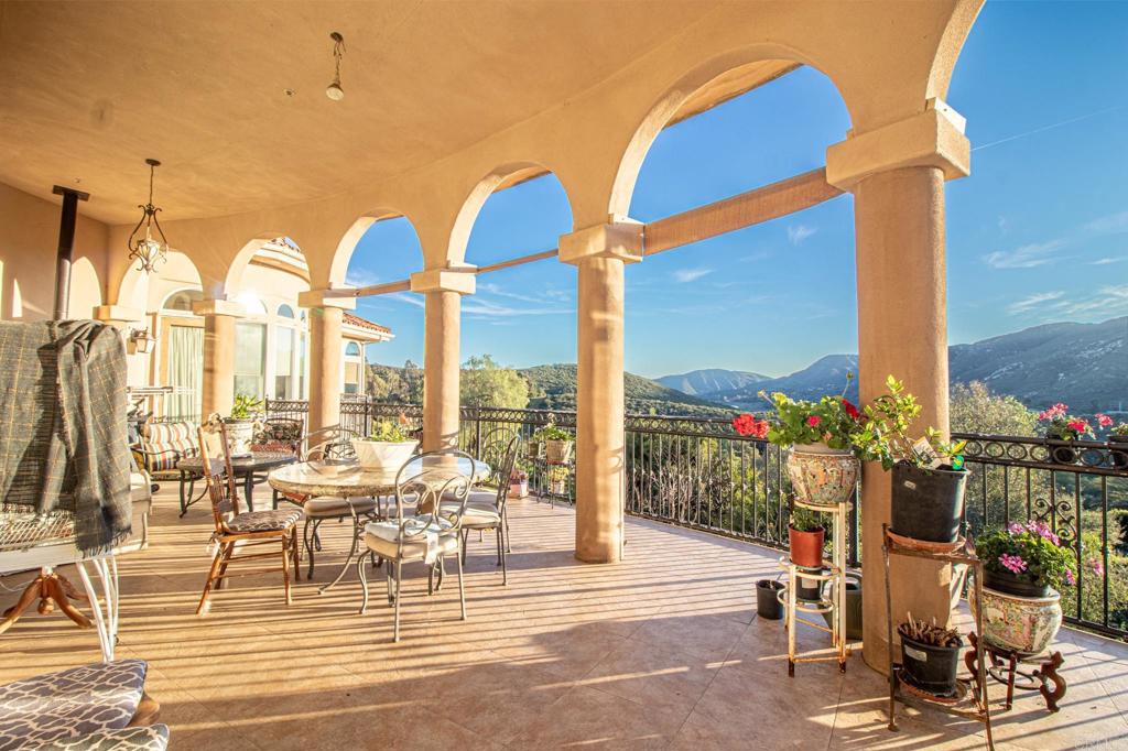 2057 Via Rancho Parkway Escondido, CA 92029 - Photo 51 of 56 a view of a patio with dining table and chairs