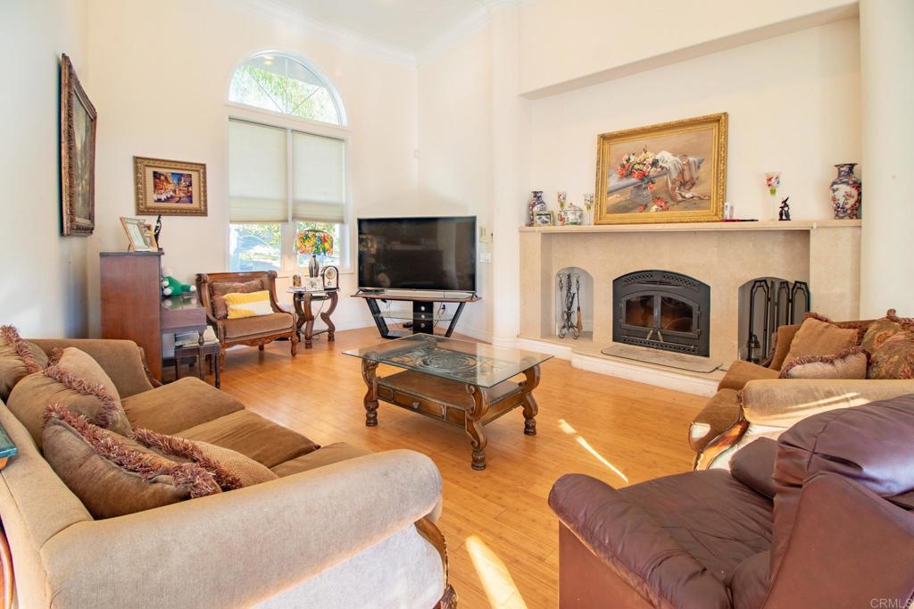 2057 Via Rancho Parkway Escondido, CA 92029 - Photo 10 of 56 a living room with furniture and a fireplace