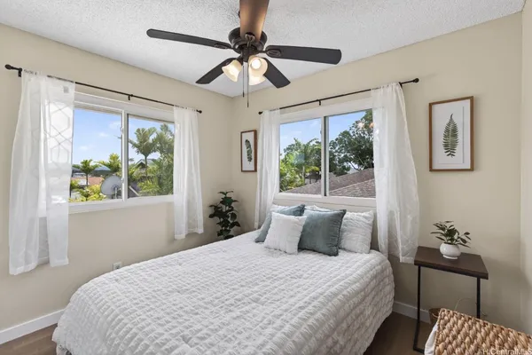 a bedroom with a large bed and a window
