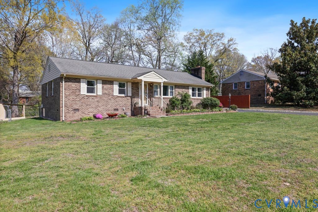2831 Delfin Road Midlothian, VA 23112 - Photo 2 of 30 a front view of house with yard and green space