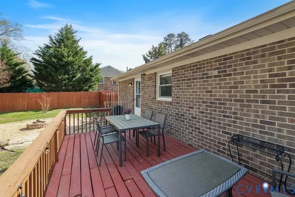 a view of a patio with wooden floor
