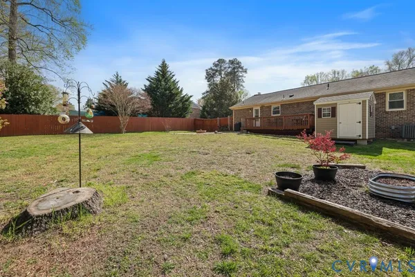 a backyard of a house with yard fire pit and outdoor seating