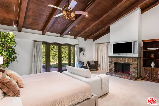 a view of a house with swimming pool and a garden