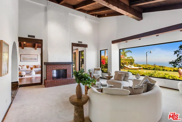 a dining room with furniture wooden floor and a chandelier