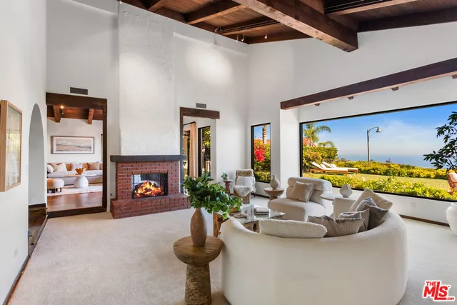 a view of a living room and dining room