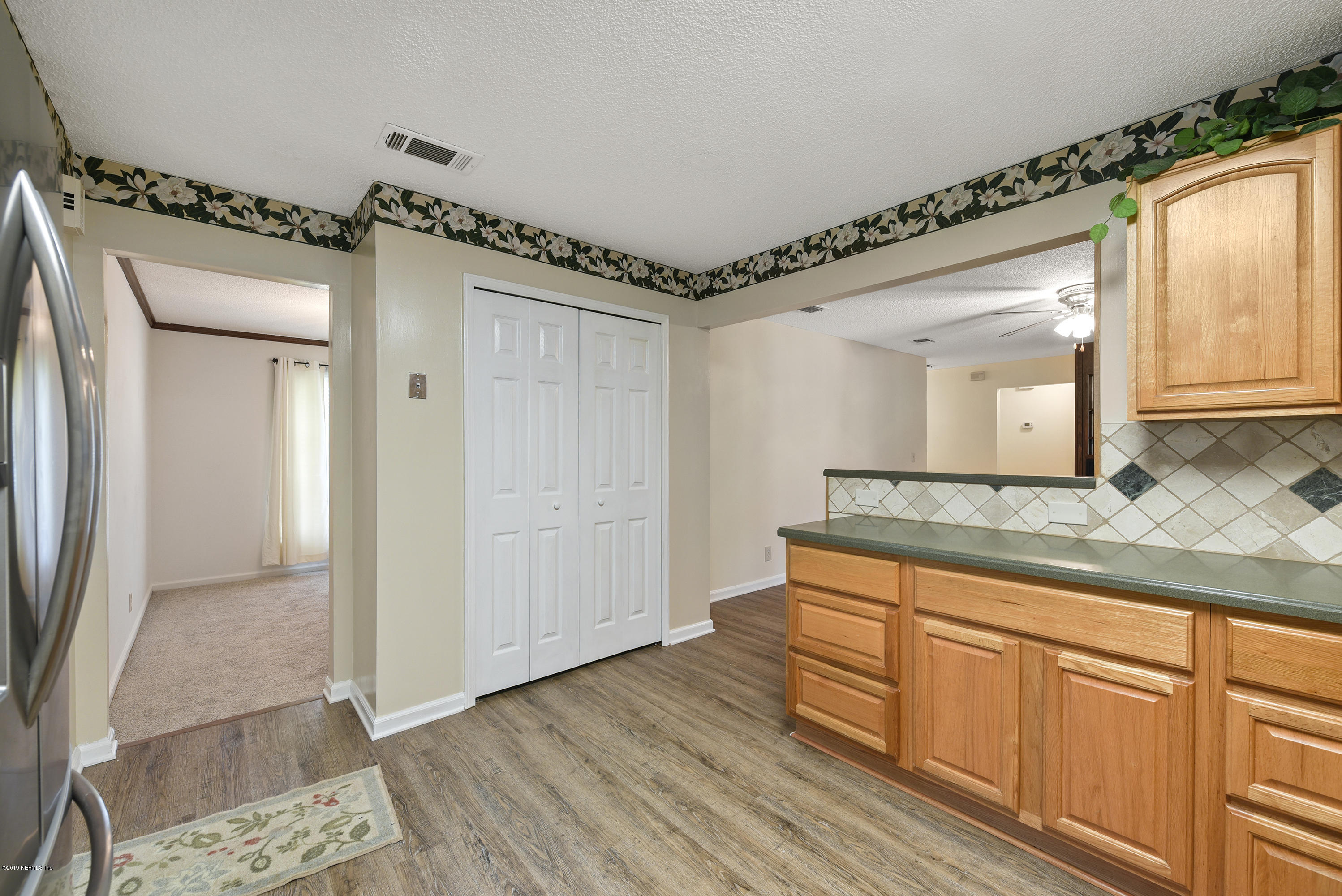 3623 Spring Lake Road Jacksonville, FL 32210 - Photo 9 of 33 Kitchen To Dining Room & Family Room