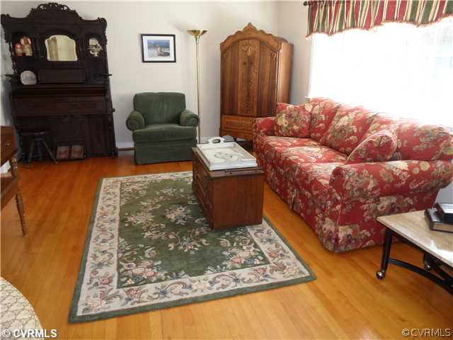 11401 Rochelle Road Chester, VA 23831 - Photo 3 of 12 a living room with furniture and a rug