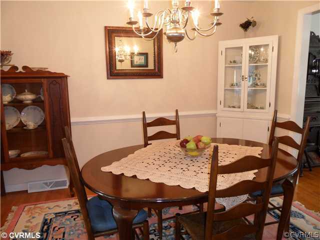 11401 Rochelle Road Chester, VA 23831 - Photo 4 of 12 a dining room with furniture and wooden floor