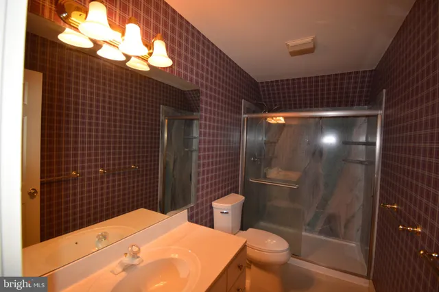 a bathroom with a sink and toilet