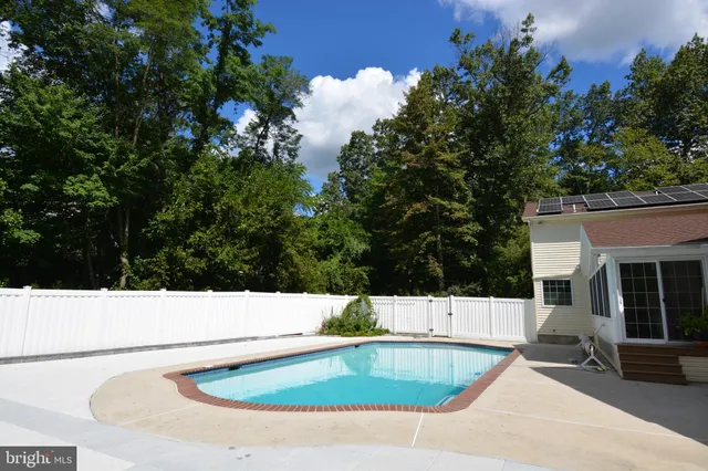 a view of outdoor space and swimming pool