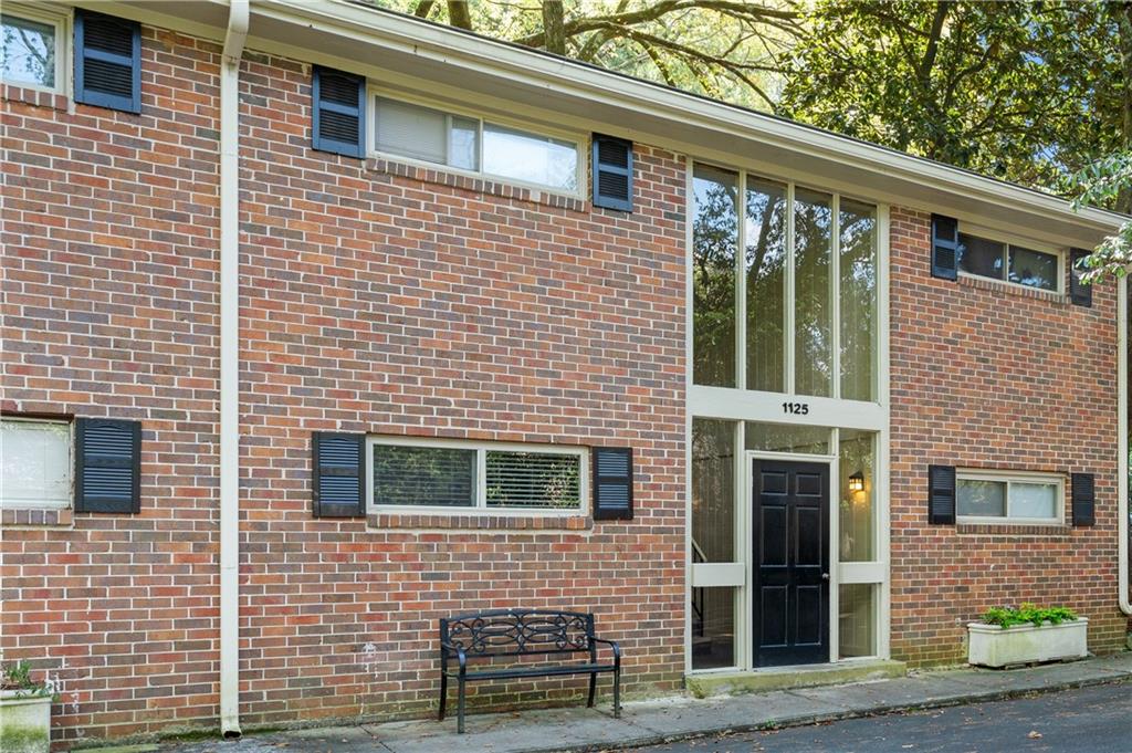 1125 Clairemont Avenue, Unit D Decatur, GA 30030 - Photo 1 of 1 a view of a house with large windows