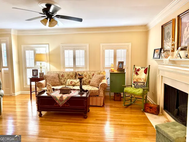 a living room with furniture or fireplace and a table