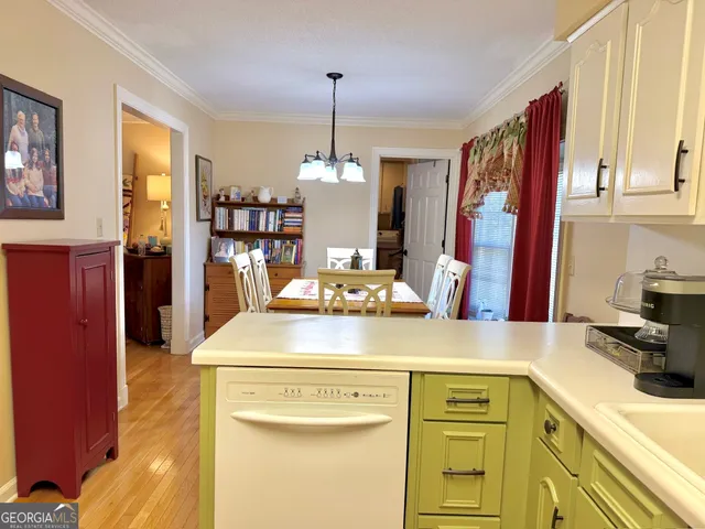 a kitchen with a sink and a refrigerator