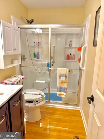 a bathroom with a sink toilet and shower