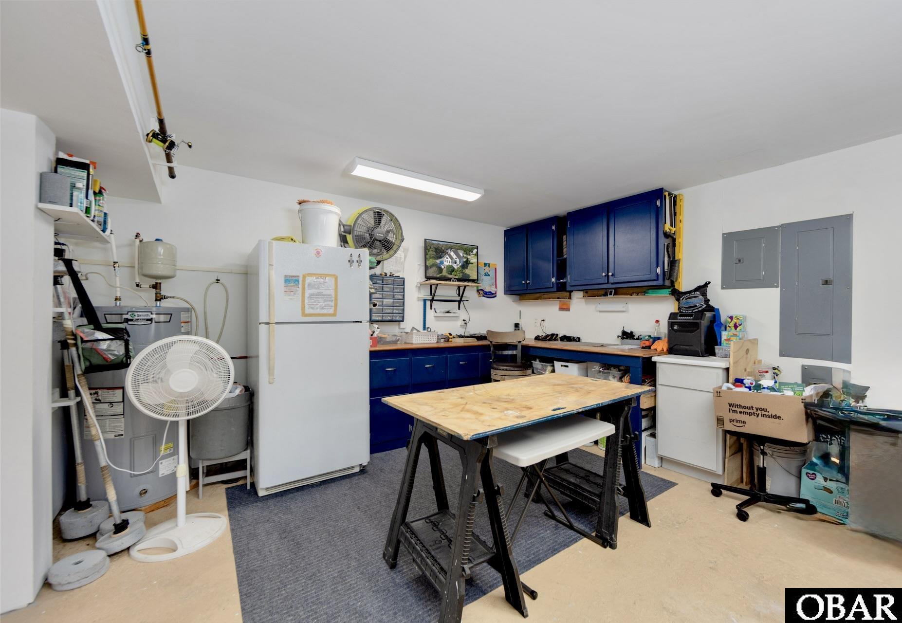 305 Oak Run, Unit 1 Kitty Hawk, NC 27949 - Photo 42 of 49 Workshop Extra Storage!