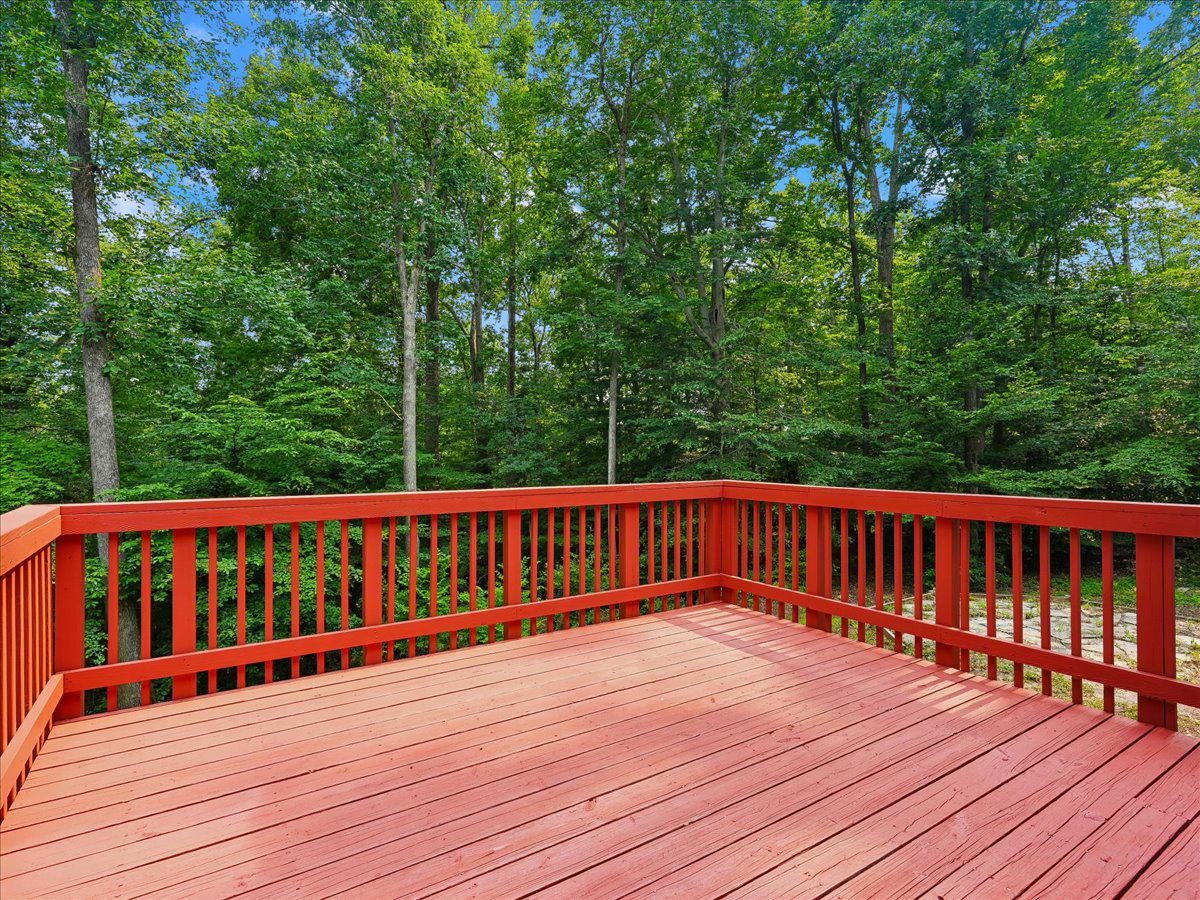 8253 Honeysuckle Road Manassas, VA 20112 - Photo 10 of 15 Large deck overlooking lush greenery.