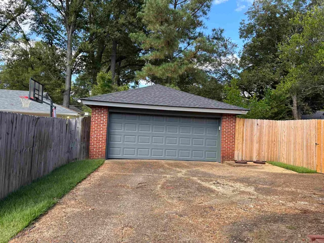 a front view of a house with a garage