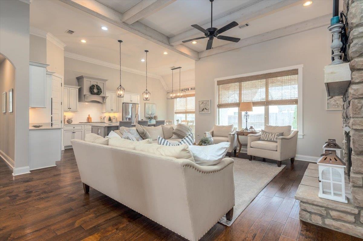608 Cypress Run Cove Collierville, TN 38017 - Photo 11 of 40 Living area with dark wood-style floors, ceiling fan, recessed lighting, and a stone fireplace