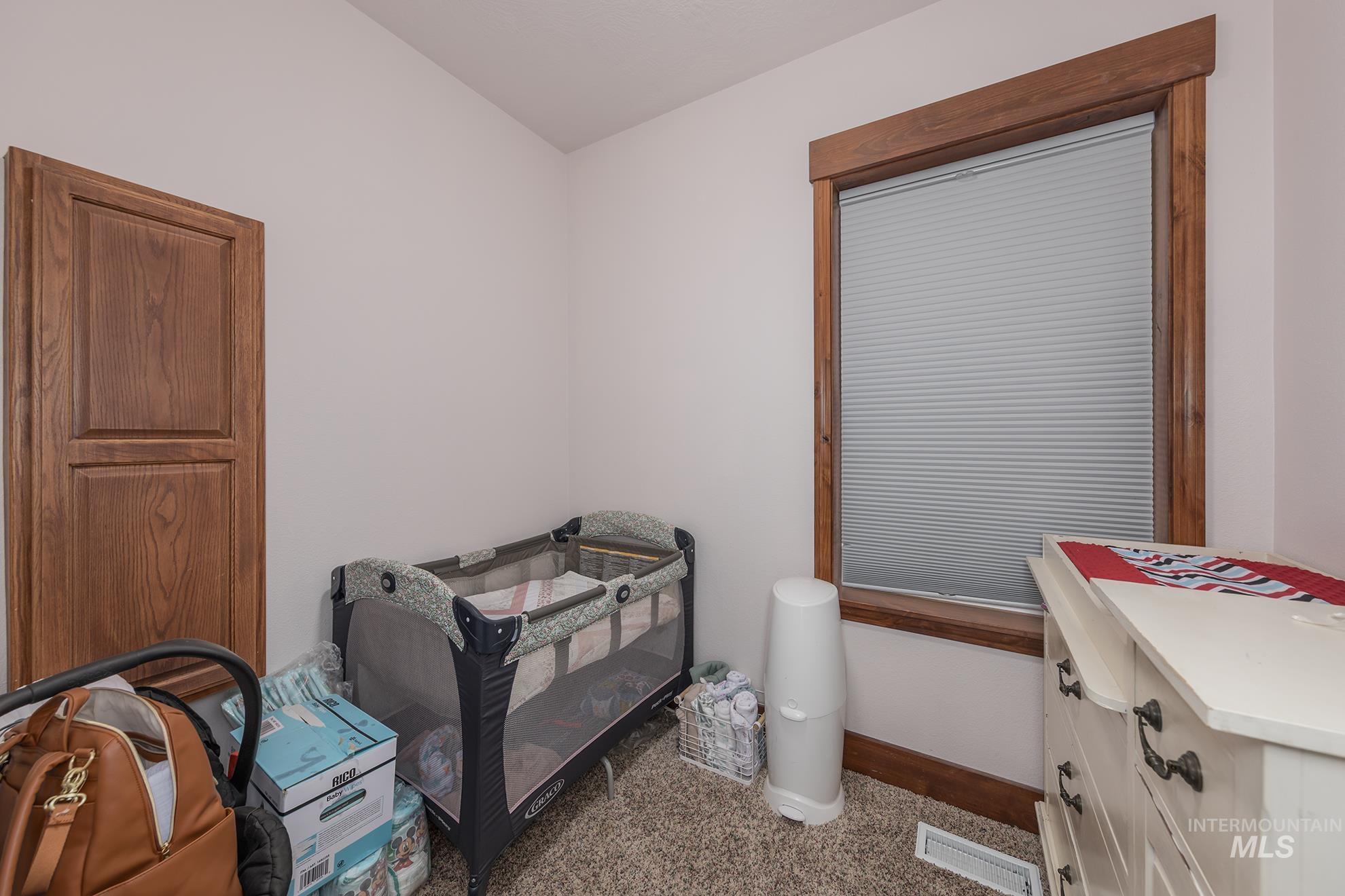 6040 Adams Road New Plymouth, ID 83655 - Photo 21 of 50 Bedroom with carpet floors and baseboards
