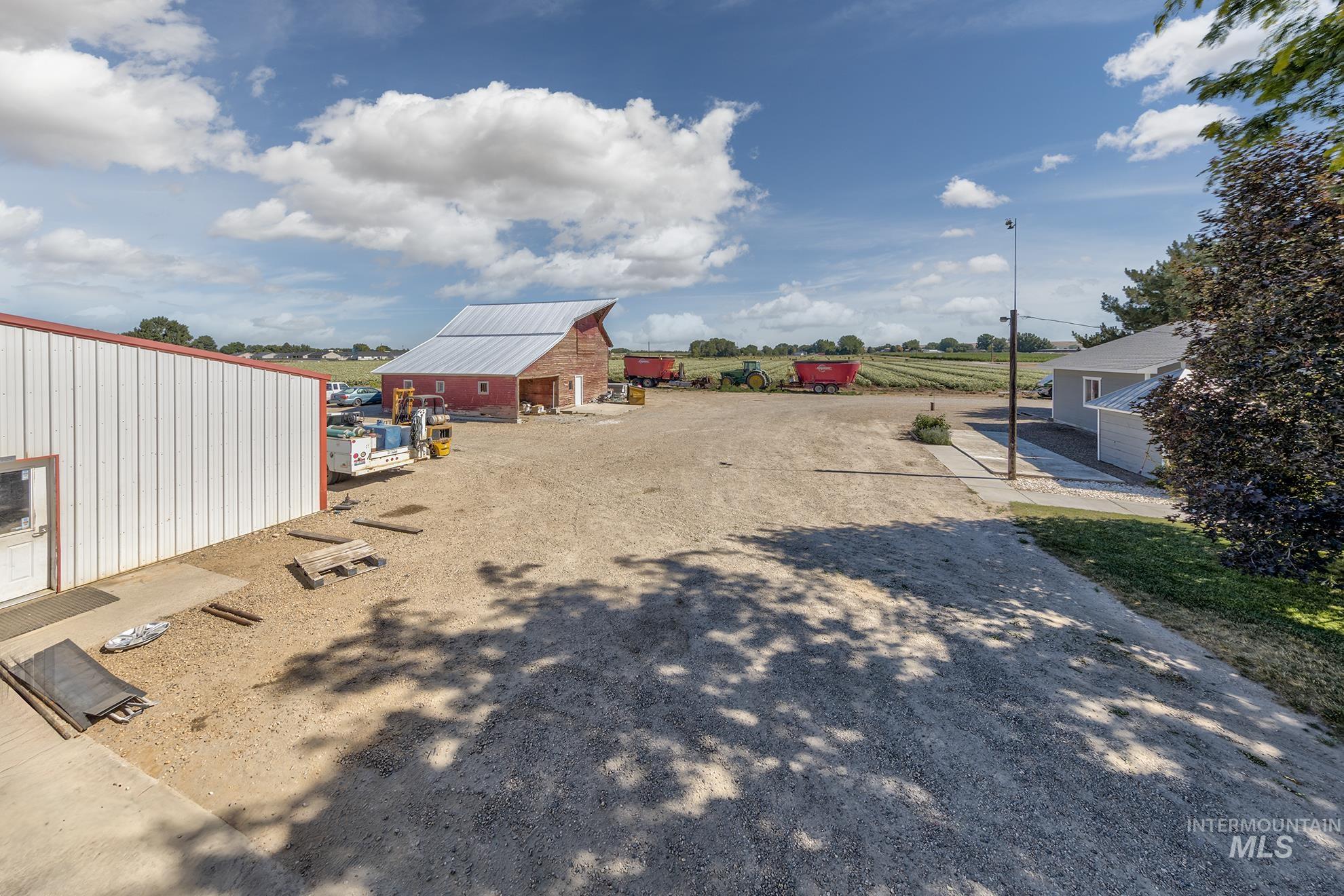 6040 Adams Road New Plymouth, ID 83655 - Photo 7 of 50 View of yard featuring an outdoor structure and a barn